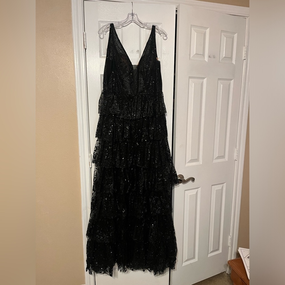 Black layered lace prom dress with a side slit.